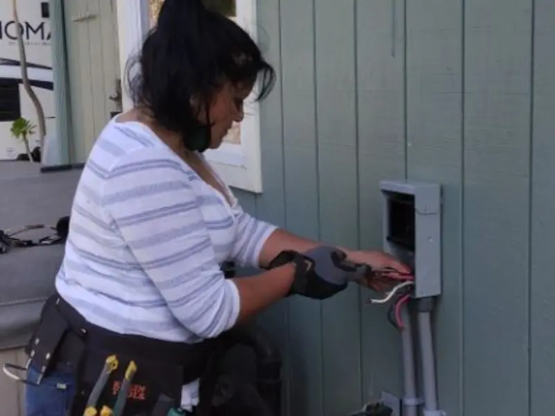 Licensed electrician wiring an exterior subpanel in Springfield